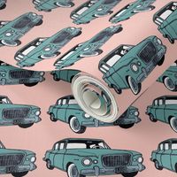 green 1959 Studebaker Lark on pink background