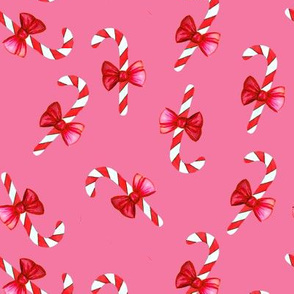 Candy canes with bow on pink