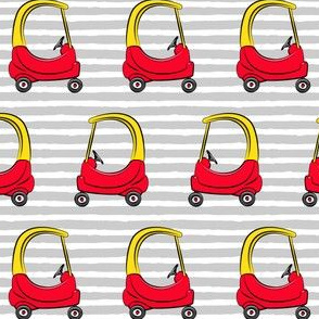 kids toy car on grey stripes (yellow)