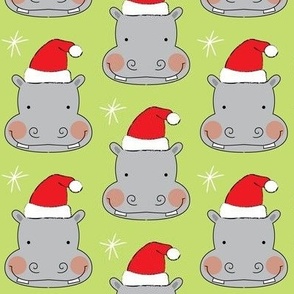 hippo-faces with santa hats on green