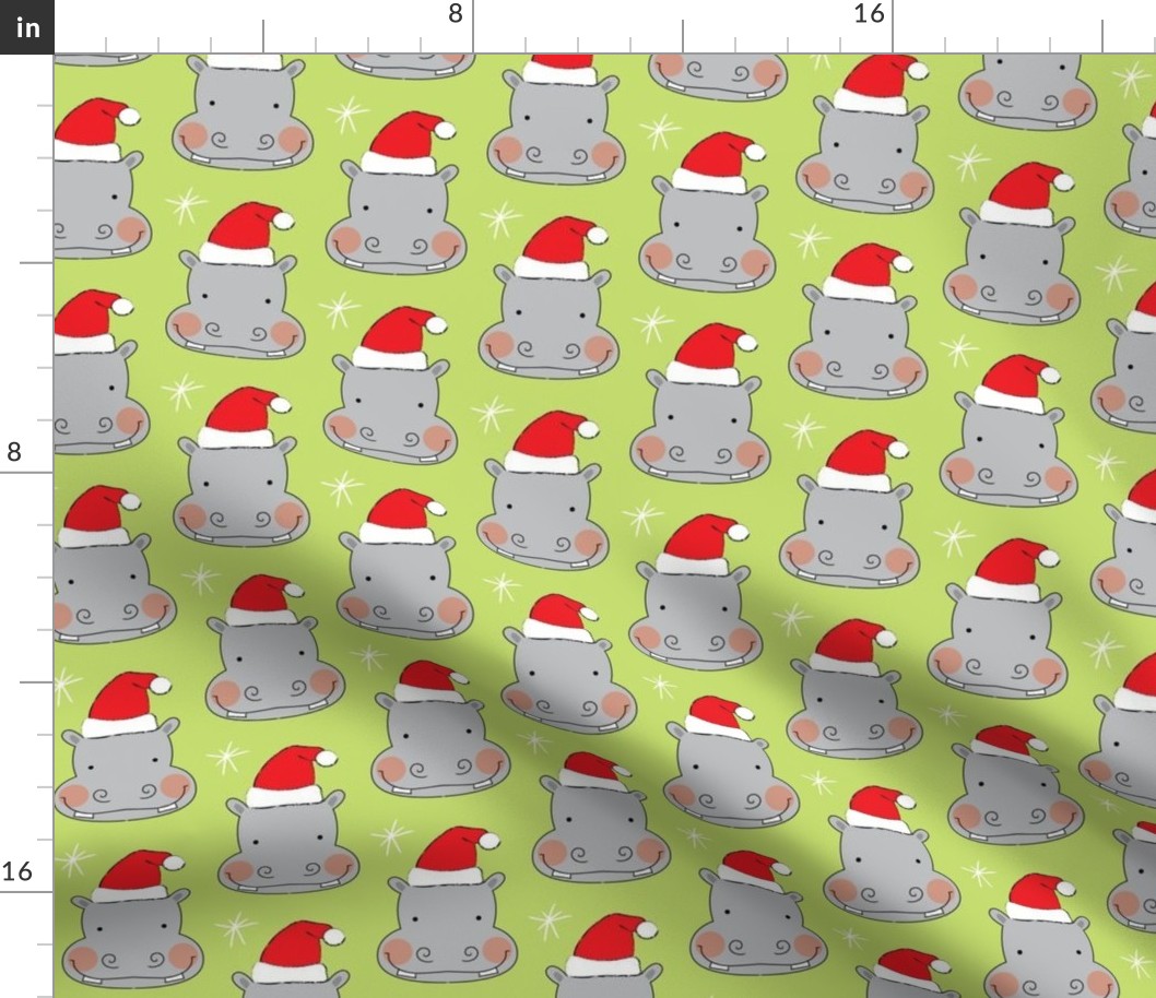 hippo-faces with santa hats on green