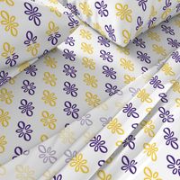 LSU white with purple and yellow diagonal oval motifs