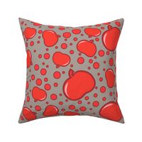 Red apples and polka dots on taupe, with a vintage, cheerful vibe.