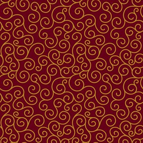 Gold curlicues on dark cranberry