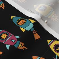 Space astronauts in rocket ships on black