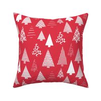 White textured Christmas tree silhouettes on red
