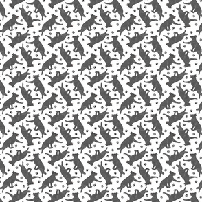 Tiny Trotting black German Shepherd dogs and paw prints - white