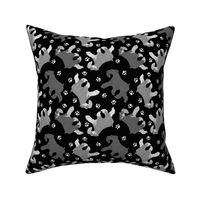 Trotting uncropped Miniature Schnauzers and paw prints - black