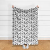 Trotting uncropped Standard Schnauzers and paw prints - white