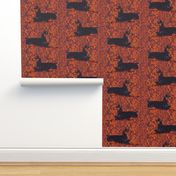 Black and Rust Doberman Lying Down on Textured Rust Background