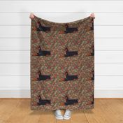 Black and Rust Doberman Lying Down in Autumn Leaves for Pillow