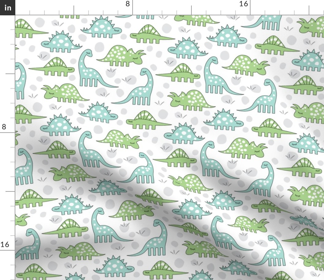 green and blue dinos on white