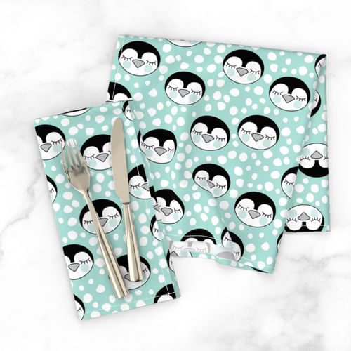 penguin-faces-with-snowballs-on-teal