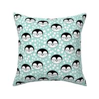 penguin-faces-with-snowballs-on-teal