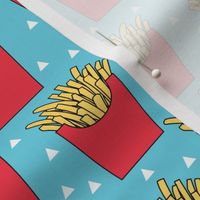 french-fries-with-red-box-on-teal