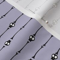 skulls horizontal in black on lavender