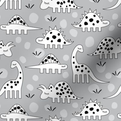 white dinosaurs with black spots on grey