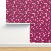 Candy canes pink with bow on burgundy