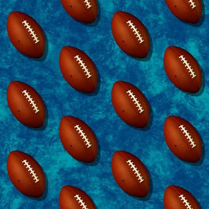 Footballs on turquoise blue w blue grunge texture sports pattern