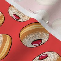 Sufganiyot (Jelly Doughnuts) toss on red