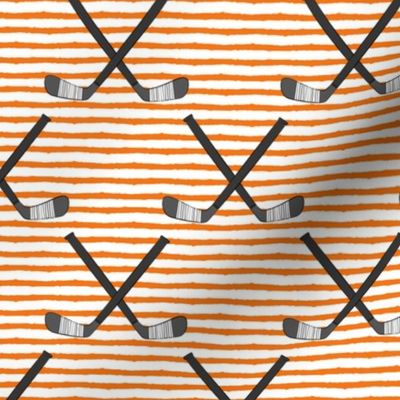 hockey sticks on stripes - orange C18BS
