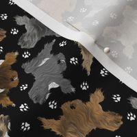 Tiny Trotting Tibetan Terriers and paw prints - black