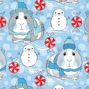 large guinea pigs snowmen and candy on blue