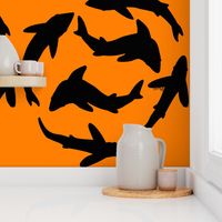 Abstract shark shadows on orange