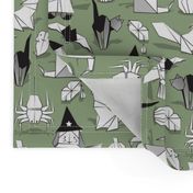 Halloween origami tricks // sage green background black and white paper geometric witches cats ghosts spiders wolfs bats Dracula lips and pumpkins