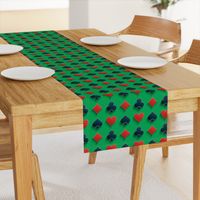 Playing Card Suits on Green Felt Casino