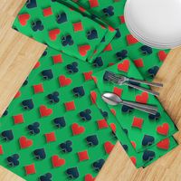 Playing Card Suits on Green Felt Casino