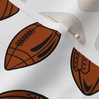 Footballs Brown Tossed on White