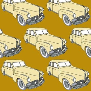 cream  1941 Studebaker sedan on golden background 