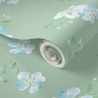 Blue watercolor flowers on green.  Use the design for crib bedding, scrub cap, duvet covers or bathroom wallpaper. 