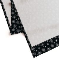 White hand-drawn snowflakes on black