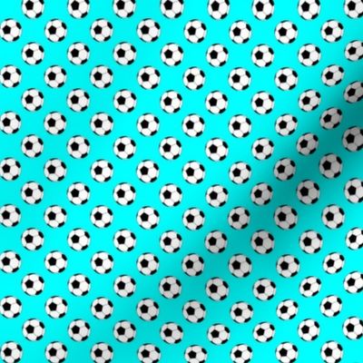 Half Inch Black and White Soccer Balls on Aqua Blue