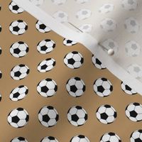 Half Inch Black and White Soccer Balls on Camel Brown