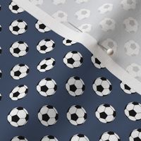 Half Inch Black and White Soccer Balls on Blue Jeans Blue