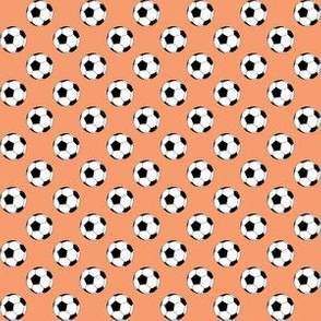 Half Inch Black and White Soccer Balls on Peach