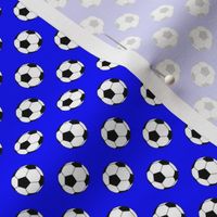 Half Inch Black and White Soccer Balls on Blue