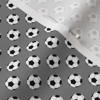 Half Inch Black and White Soccer Balls on Medium Gray