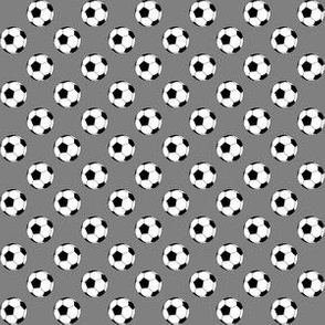 Half Inch Black and White Soccer Balls on Medium Gray