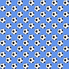 Half Inch Black and White Soccer Balls on Cornflower Blue