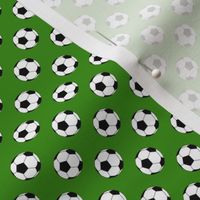 Half Inch Black and White Soccer Balls on Apple Green