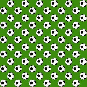 Half Inch Black and White Soccer Balls on Apple Green