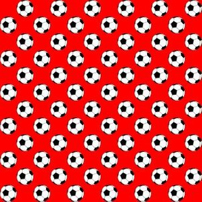 Half Inch Black and White Soccer Balls on Red