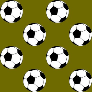 Two Inch Black and White Soccer Balls on Olive Green
