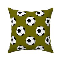 Three Inch Black and White Soccer Balls on Olive Green