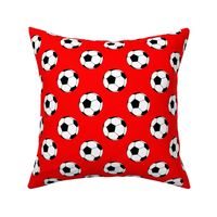 Two Inch Black and White Sports Soccer Balls on Red