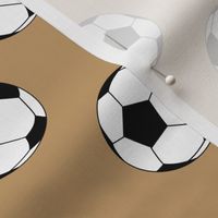 Two Inch Black and White Soccer Balls on Camel Brown